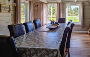 a conference room with a long table and chairs at Stunning Home In Bjelland With 3 Bedrooms in Bjelland
