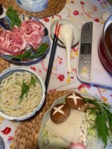 a table topped with plates of food on a table at B&B legare in Gifu