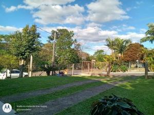 a yard with a park with a playground at Casa da NONNA in Gramado