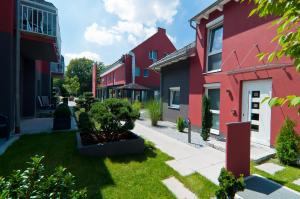 a street in a town with red houses at Amalienburg - Boutique & Boarding Hotel in Munich