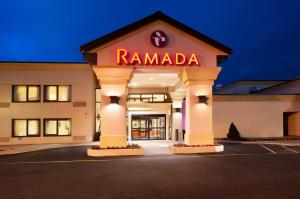 a rendering of a ramada hotel at night at Ramada by Wyndham Newark/Wilmington in Newark