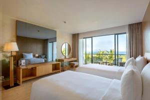 Postel nebo postele na pokoji v ubytování Selectum Noa Resort Cam Ranh