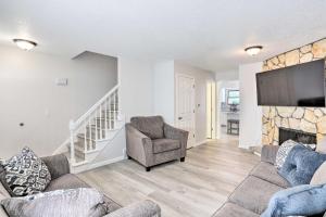 a living room with a couch and a fireplace at Bright Toledo Duplex, Close to Parks and Trails in Toledo