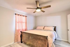 a bedroom with a bed with a ceiling fan at Bright Toledo Duplex, Close to Parks and Trails in Toledo