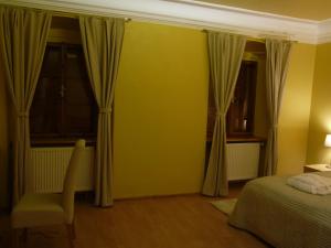 Posteľ alebo postele v izbe v ubytovaní Apartments and Suites Kremnica