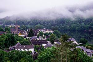 a small town in a valley with a mountain at Ferienhaus Sonnendeck 2 in Simmerath