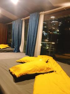 Säng eller sängar i ett rum på Nhà Trên Mây - Homstay Tam Đảo