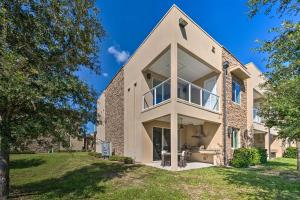 a large brick house with a large window at Upscale Townhome Close to Walt Disney World! in Orlando