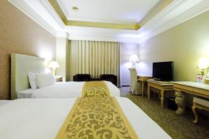 Krevet ili kreveti u jedinici u objektu F Hotel - Taichung