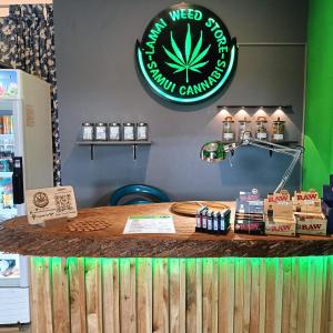a counter at a cannabis dispensary with a sign on it at Samui Guest House in Lamai
