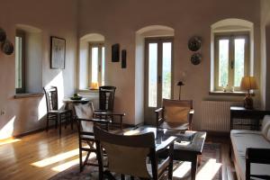 a living room with a table and chairs at The Stonehouse in Stemnitsa
