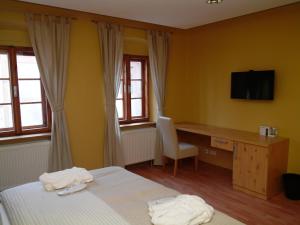Posteľ alebo postele v izbe v ubytovaní Apartments and Suites Kremnica