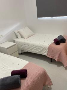 Ein Bett oder Betten in einem Zimmer der Unterkunft Pensión Coripe