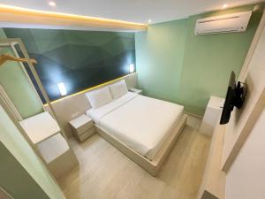 Ліжко або ліжка в номері LEAF HoteL