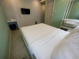 Ліжко або ліжка в номері LEAF HoteL