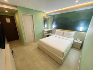 Ліжко або ліжка в номері LEAF HoteL