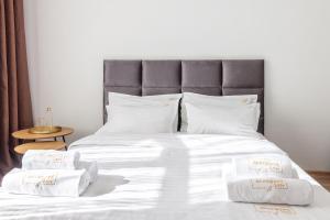 Кровать или кровати в номере Avangard Liberty Avenue Apart