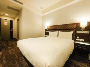 Krevet ili kreveti u jedinici u okviru objekta Hub Hotel Banqiao Branch