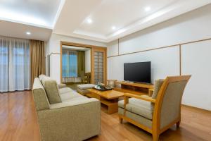TV a/nebo společenská místnost v ubytování Belgravia Serviced Residence Wuxi