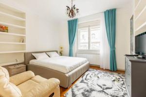 a bedroom with a bed and a tiger rug at Apartment Artist in Belgrade