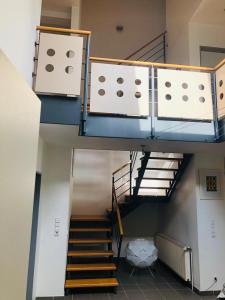 a staircase in a building with a stair case at Modernes Architektenhaus am Jadebusen in Varel