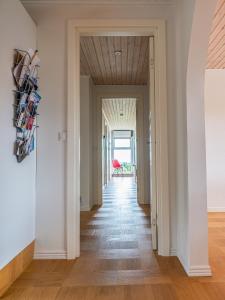 a hallway with white walls and a wooden ceiling at Marna Guesthouse doubleroom nr.2 in Tórshavn