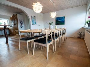 a dining room with a table and chairs at Marna Guesthouse doubleroom nr.2 in Tórshavn