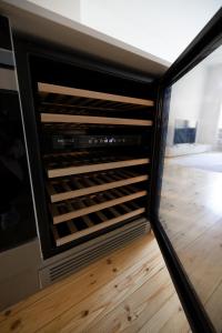 a view of a wine rack in a room at 2ndhomes Luxury 3 BR Brand New 106 m2 Apartment with Spa in Helsinki Center in Helsinki