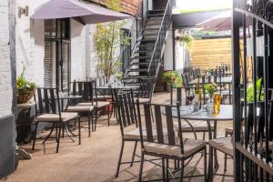 a row of tables and chairs on a patio at The Chapter House in Salisbury