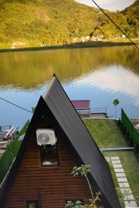 a small house with a view of a lake at Unique Lake House Paradiso in Zvornik