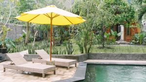 Ein Garten an der Unterkunft Lullabi Lumbung Villa