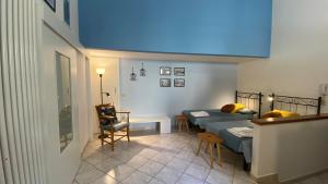 a bedroom with a bed and a table and a chair at RomagnaBNB Studio Ripa in Forlì