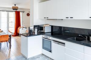 Köök või kööginurk majutusasutuses Superbe Appartement F4 Puteaux