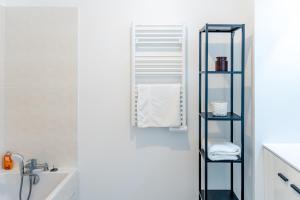 Vannituba majutusasutuses Superbe Appartement F4 Puteaux