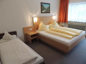 מיטה או מיטות בחדר ב-Pension Winnebach