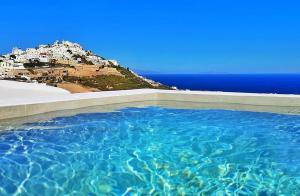 a pool of water with a view of a city at Martynou View in Pirgos