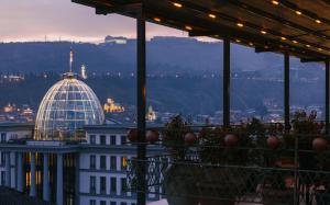a view of a building with a dome on top of it at Brim Hotel in Tbilisi City
