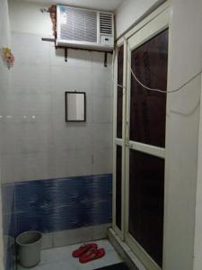 a room with a window and a air conditioner at Vedanta Hotel, Bareilly in Bareilly