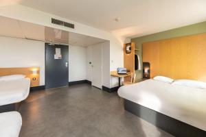 Postel nebo postele na pokoji v ubytování B&B HOTEL Lyon Sud États-Unis + 37 fotografií