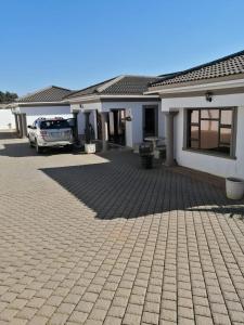 a car parked in front of a house at Luqa BnB in Empangeni