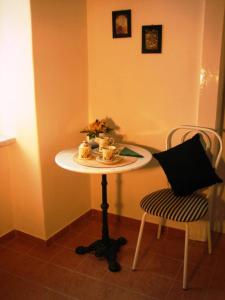 a small table in a room with a chair at Apartment Haydnpark in Vienna