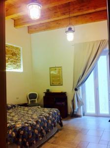 Posteľ alebo postele v izbe v ubytovaní B & B Stella Marina