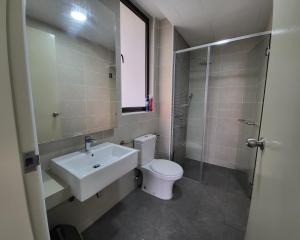 a bathroom with a sink and a toilet at Bali Residence Impian Raudah in Melaka