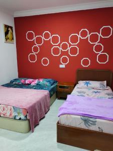 Cama ou camas em um quarto em EZ Roomstay