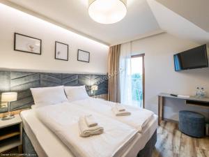 Villa & Gospoda Krakowska客房内的一张或多张床位