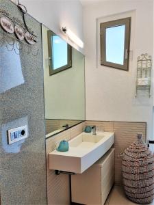 a bathroom with a sink and a mirror at Minzoni Tony Gallipoli in Gallipoli +76 photos