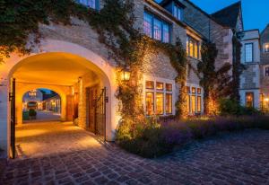 an entrance to a building with an archway at Whatley Manor in Malmesbury