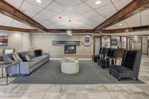 a living room with a couch and chairs and a fireplace at 1 Bedroom Ski In, Ski Out Mountain Vacation Rental Located Next To Historic Main Street In Downtown Breckenridge in Breckenridge