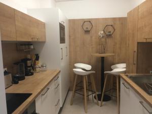 Kuchyň nebo kuchyňský kout v ubytování Magnolia Apartman