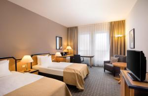Postel nebo postele na pokoji v ubytování HI Hotel International Hamburg + 37 fotografií